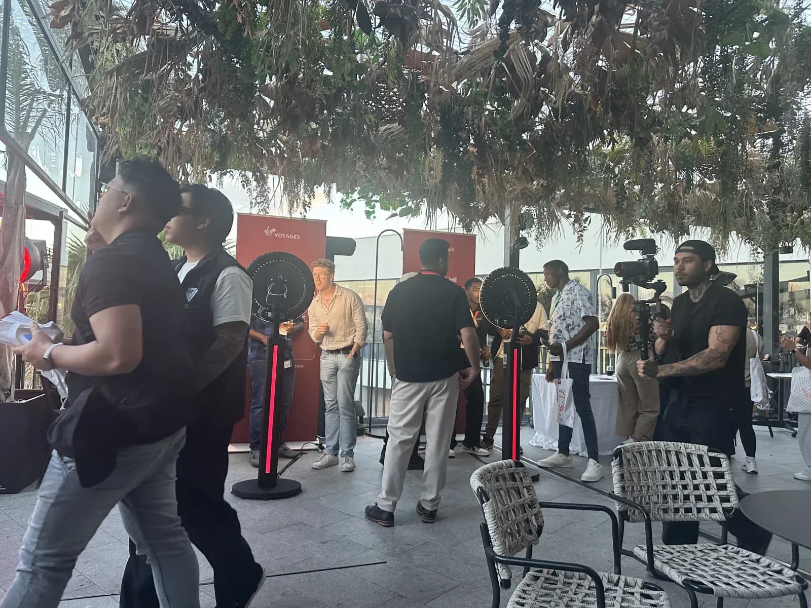 Guests queueing at staffed Photoworld ring-light booths during an outdoor activation